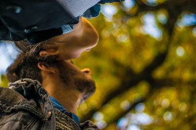 Low angle view of young woman outdoors