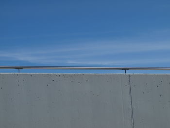 Concrete wall against sky