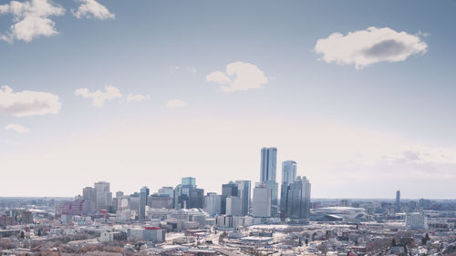 Modern buildings in city against sky