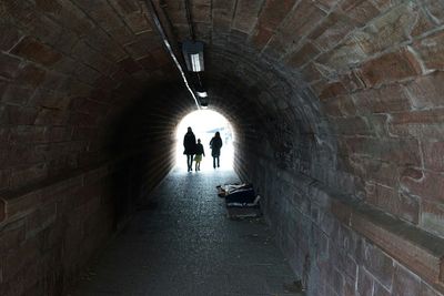 People walking in tunnel