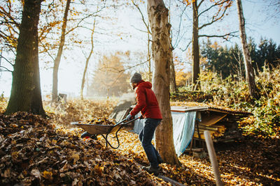 Full length of man standing in forest