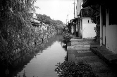 Canal amidst buildings in city