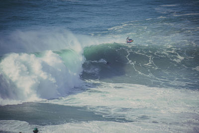 High angle view of waves on beach