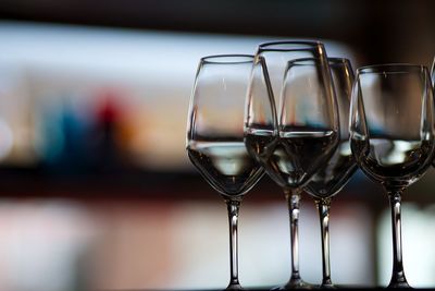 Close-up of wine glasses against blurred background