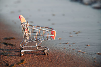 Close-up of shopping cart on table