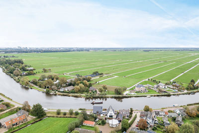 High angle view of grassy field against sky