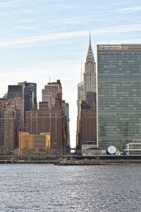 View of skyscrapers against river