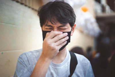 Portrait of young man using mobile phone