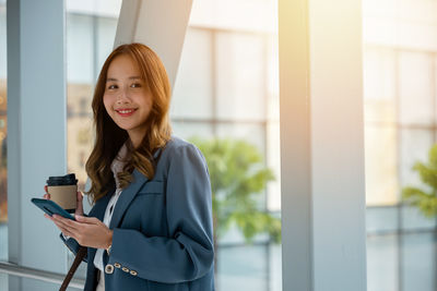 Young woman using mobile phone