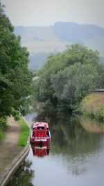 Boat on river against sky