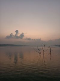 Scenic view of lake against sky during sunset