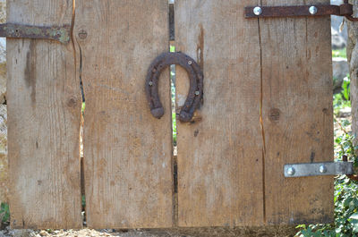 Close-up of old wooden door knocker