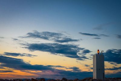 Low angle view of silhouette building against sky during sunset