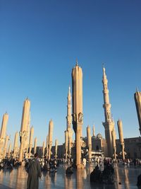 Panoramic view of buildings in city against clear sky