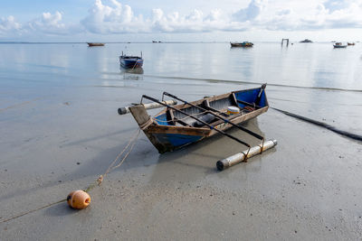 Boats moored on sea