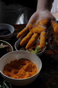 Midsection of person preparing food