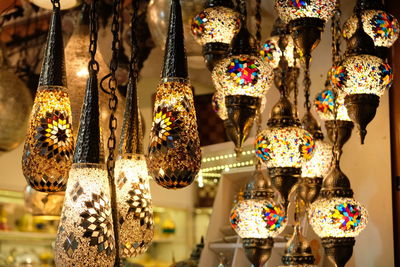 Close-up of pendent lights hanging in store