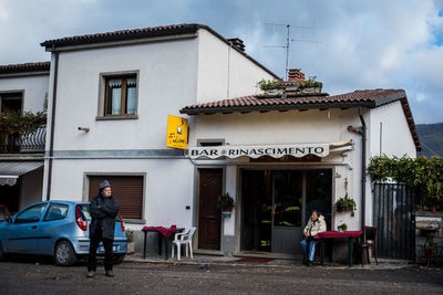 People in front of building