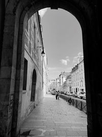 Street amidst buildings against sky