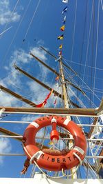 Low angle view of ship against blue sky