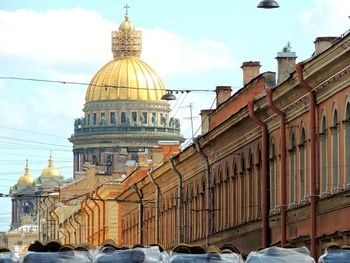 Low angle view of buildings and st isaac cathedral against sky