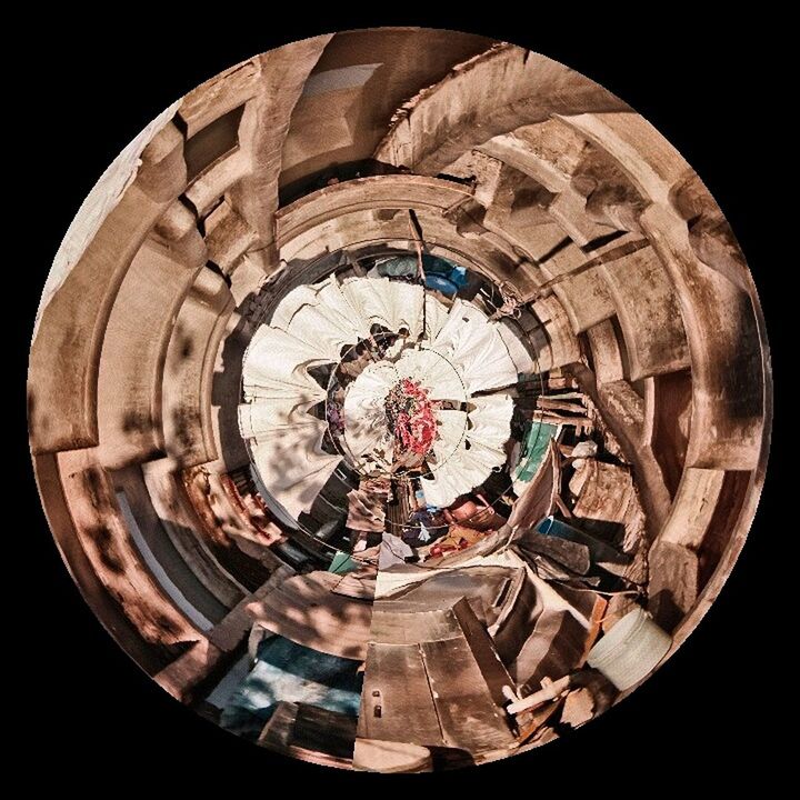 circle, indoors, fish-eye lens, geometric shape, creativity, art and craft, art, arts culture and entertainment, wheel, abandoned, high angle view, round, close-up, shape, day, old, metal, time, leisure activity