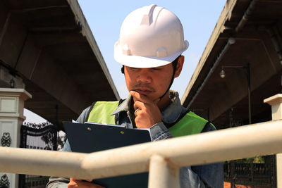 Midsection of man standing in construction site