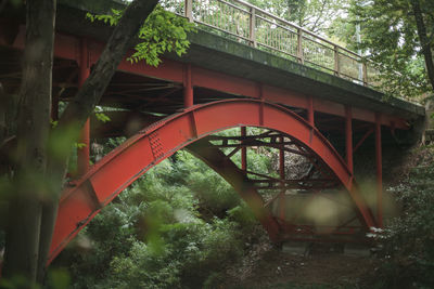 Low angle view of bridge against trees