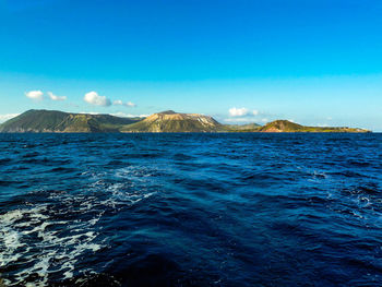 Scenic view of sea against clear blue sky