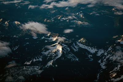 Aerial view of mountain range against sky