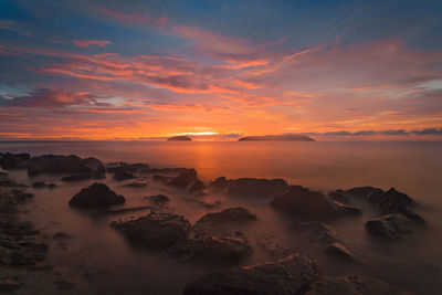 Scenic view of dramatic sky during sunset