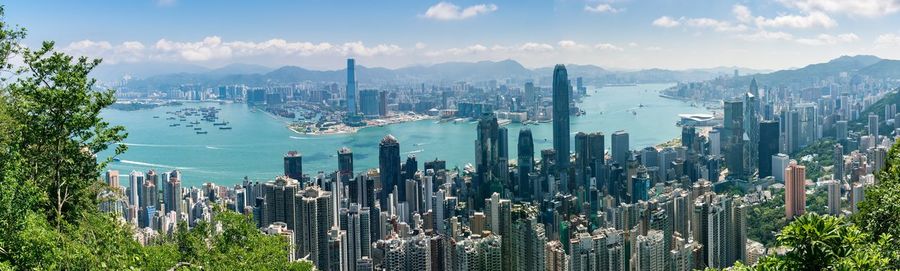 Panoramic view of city and buildings against sky