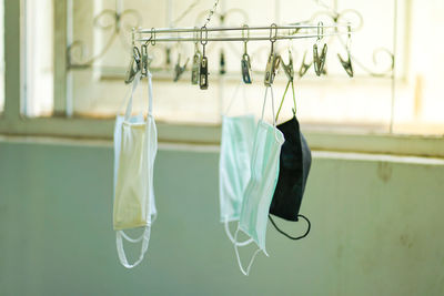 Close-up of clothes drying on clothesline at home