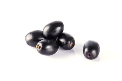 Close-up of fruits against white background