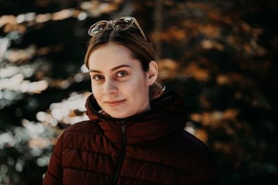 Portrait of young woman standing outdoors