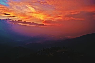 Silhouette of mountain range at sunset