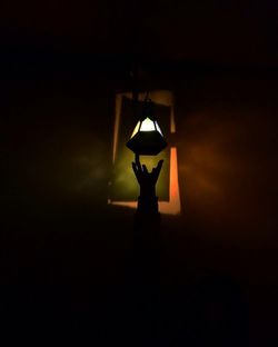 Illuminated lamp in dark room