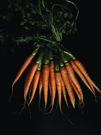 Close-up of fresh vegetables against black background