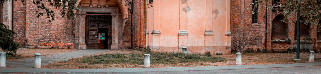 Footpath by buildings in city