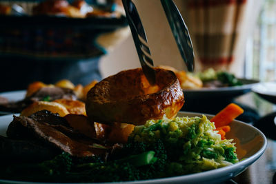 Close-up of food in plate on table