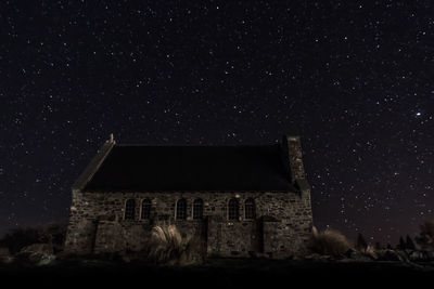 Built structure against sky at night