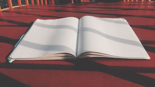 High angle view of book on table