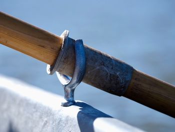 Close-up of rope on wood against sky