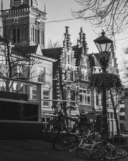 Bicycle on street amidst buildings in city