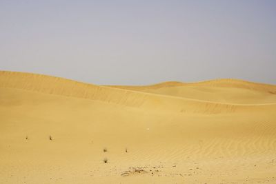 Scenic view of desert against clear sky