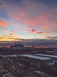 High angle view of buildings against sky during sunset