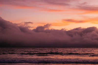 Scenic view of sea against dramatic sky