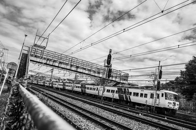 Train on railroad tracks against sky