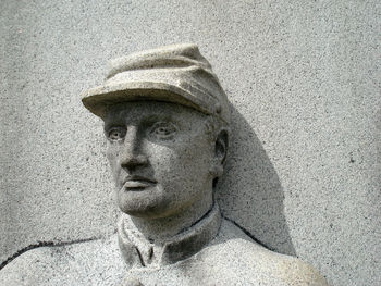 Close-up of soldier sculpture on wall