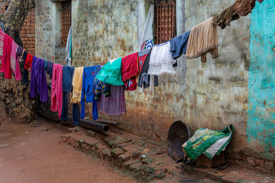 Clothes drying against wall in city